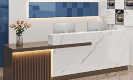 What are some durable and low-maintenance materials for reception tables?