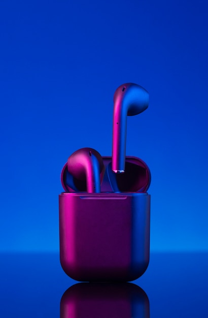 [freepicdownloader.com]-wireless-earbuds-with-neon-cyberpunk-style-lighting-normal