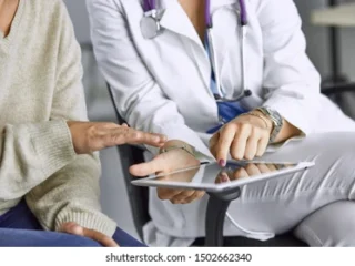 female-doctor-talking-patient-on-260nw-1502662340
